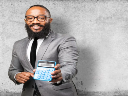 man-smiling-with-calculator